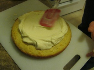 Place frosting in the middle of the cake and spread outward with a circular motion.
